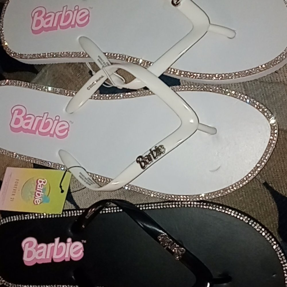 Both pairs of flip flops limited edition collectors Barbie!!